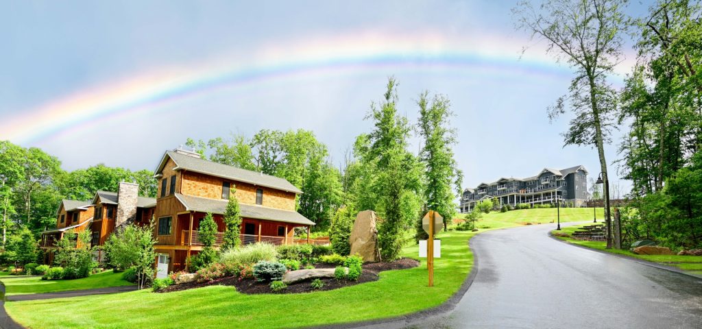 Rainbow over luxury homes at The Preserve Resort & Spa