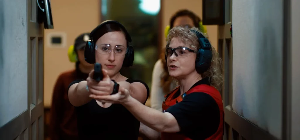 Woman receiving gun training at The Range