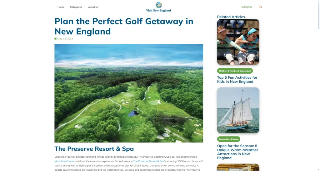 Aerial shot of a golf course in New England surrounded by lush greenery.