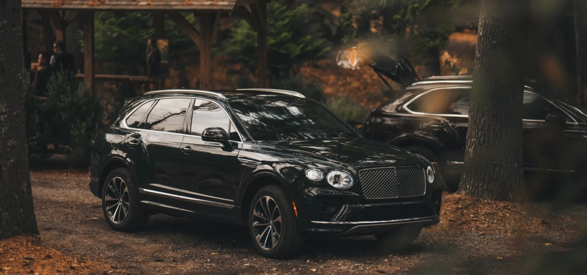 Bentley Bentayga parked in a scenic woodland area at The Preserve.