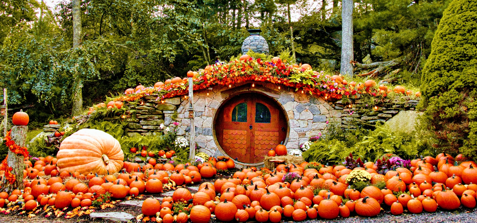 Exterior view of The Preserve's Hobbit House with fall decorations.