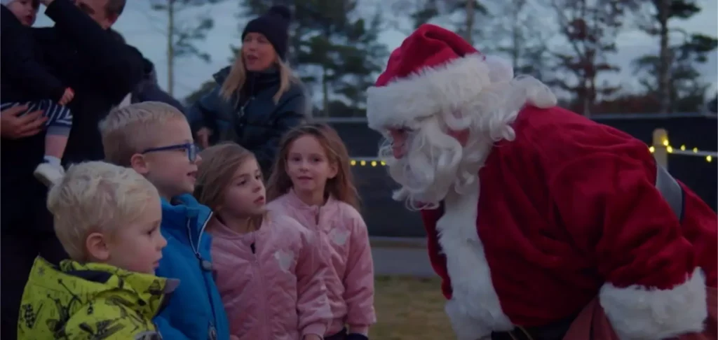 Santa Claus greeting children at the Preserve Sporting Club Christmas Tree Lighting event