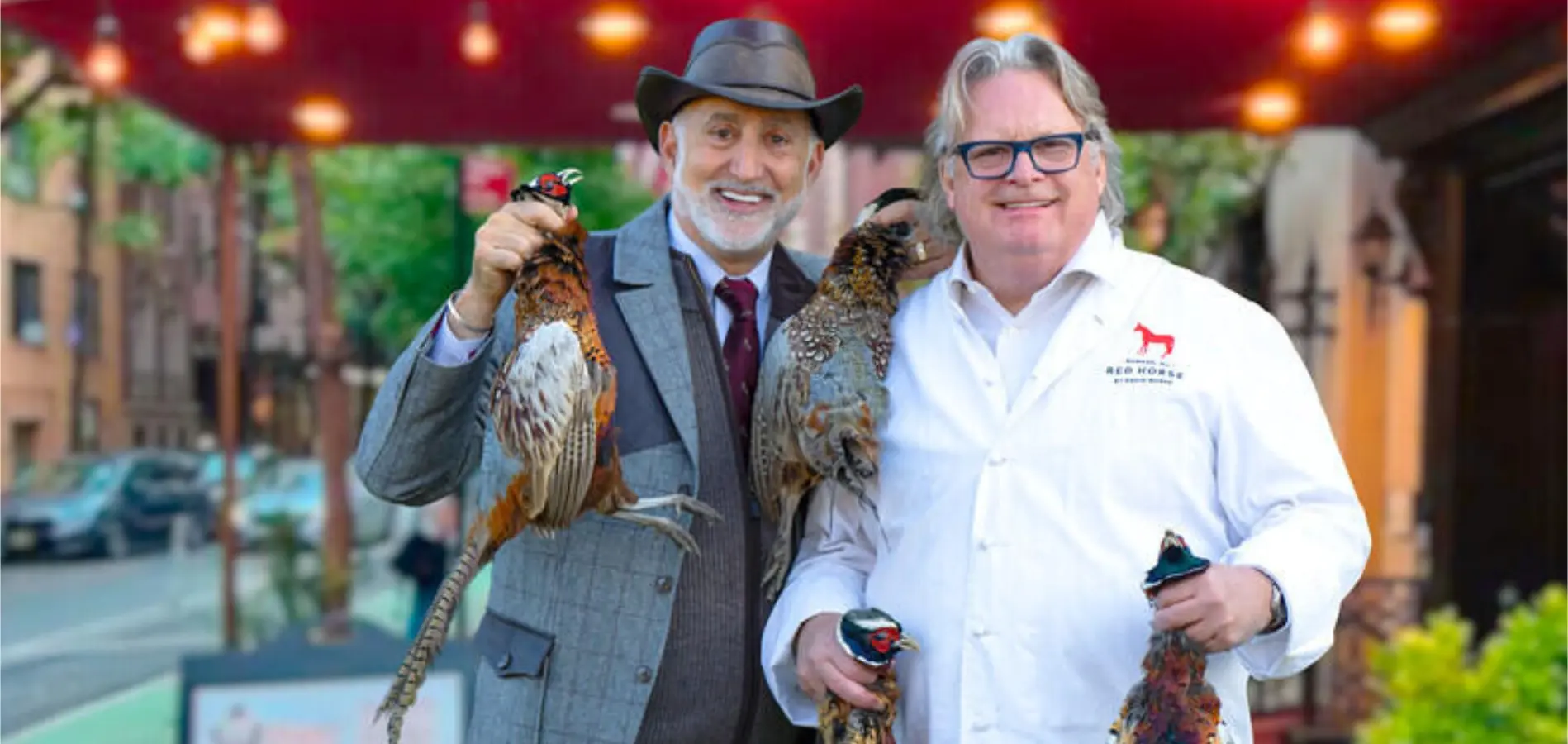 Paul Mihailides and Chef David Burke holding pheasants at David Burke Tavern.